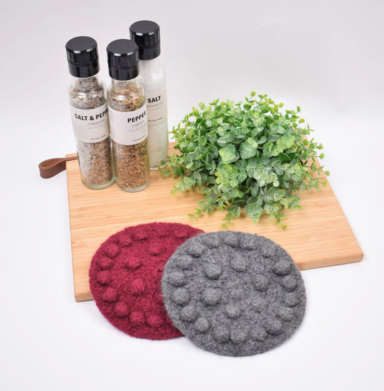 Tovet gryteunderlag med blomst i bobler