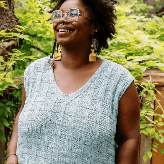 

Calme Top - Ermeløs Kurvflettet Topp
4